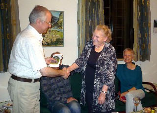 Mrs. Weiss Giving Rev. Haddad her Kind Donation